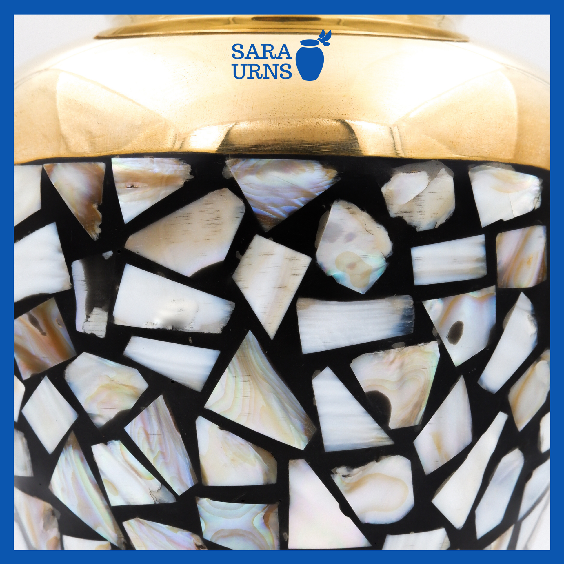 A close-up angle of a golden polished brass metal urn which highlights its shell mosaic design.