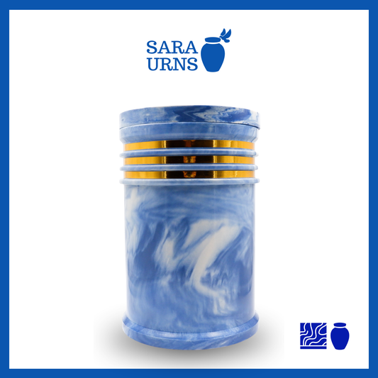 A polished blue cultured marble urn with an abstract, liquid marble pattern and gold detail over a white background.