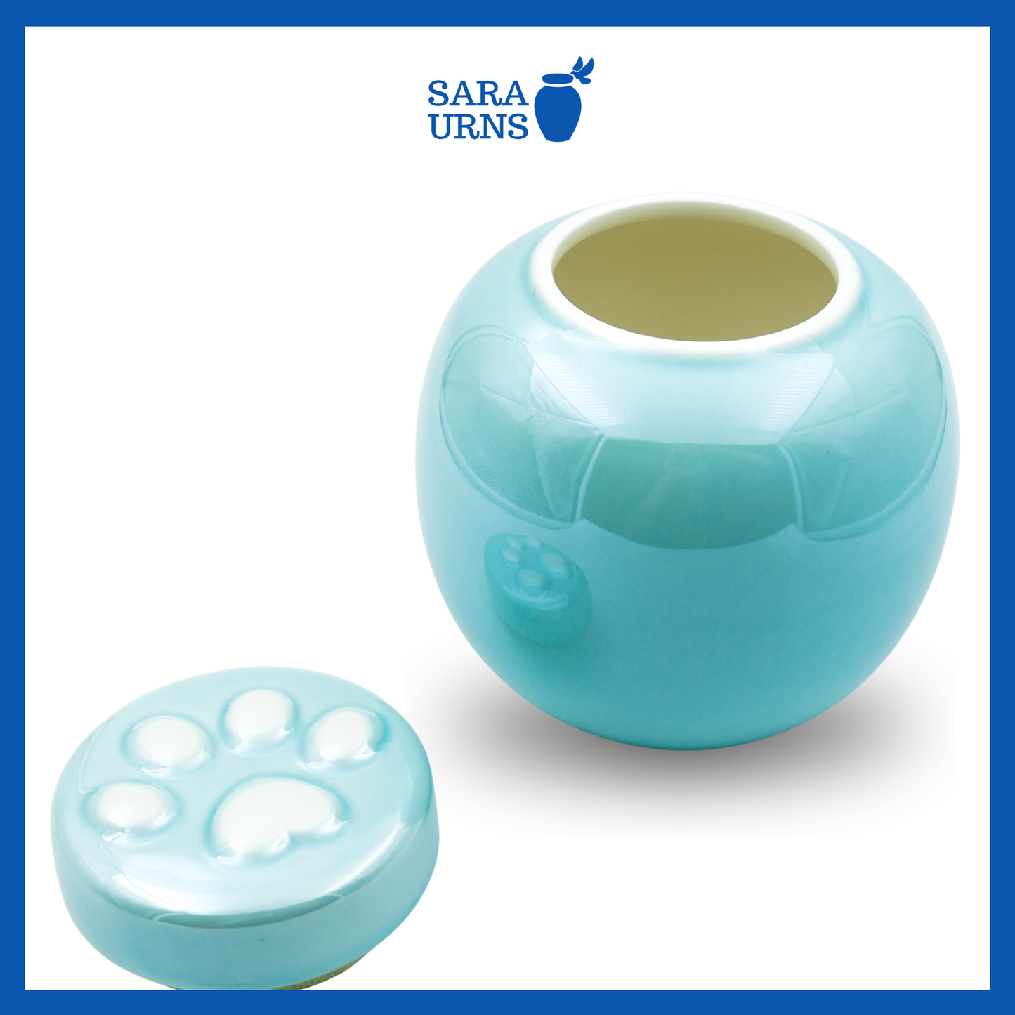 An open blue ceramic pet urn with a pearly finish with its lid placed beside it.