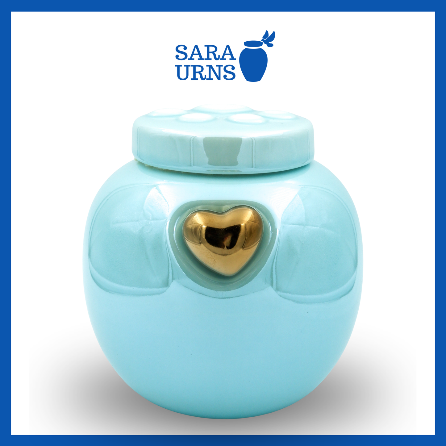A close-up shot of a blue ceramic pet urn which highlights its pearly finish and gold heart at its center.