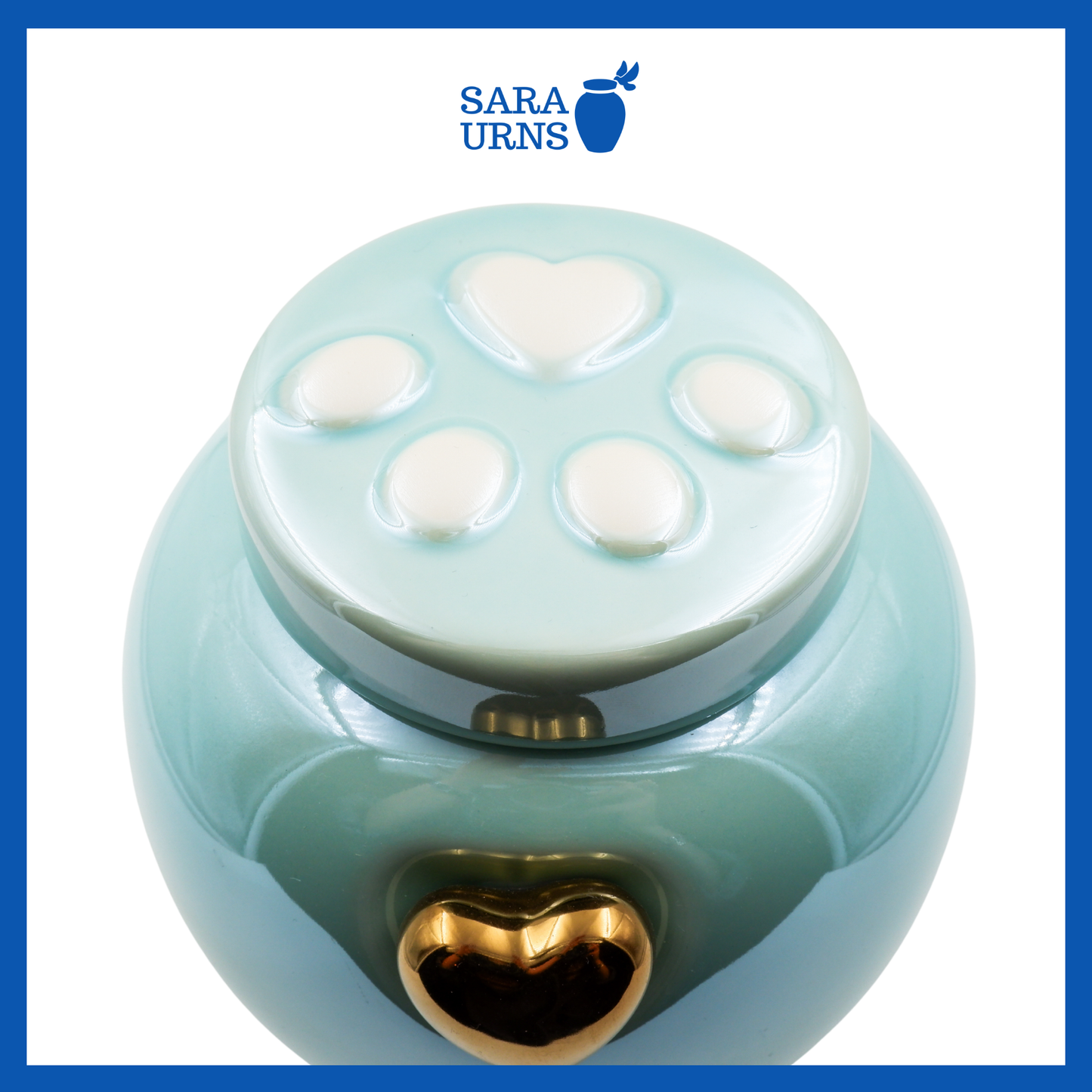 A higher angle of a blue ceramic pet urn with an embossed paw detail in the lid over a white background.