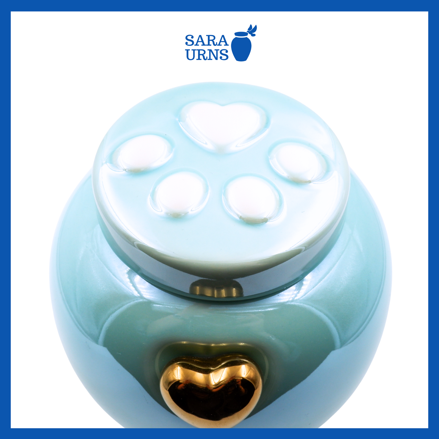 A higher angle of a blue ceramic pet urn with an embossed paw detail in the lid over a white background.