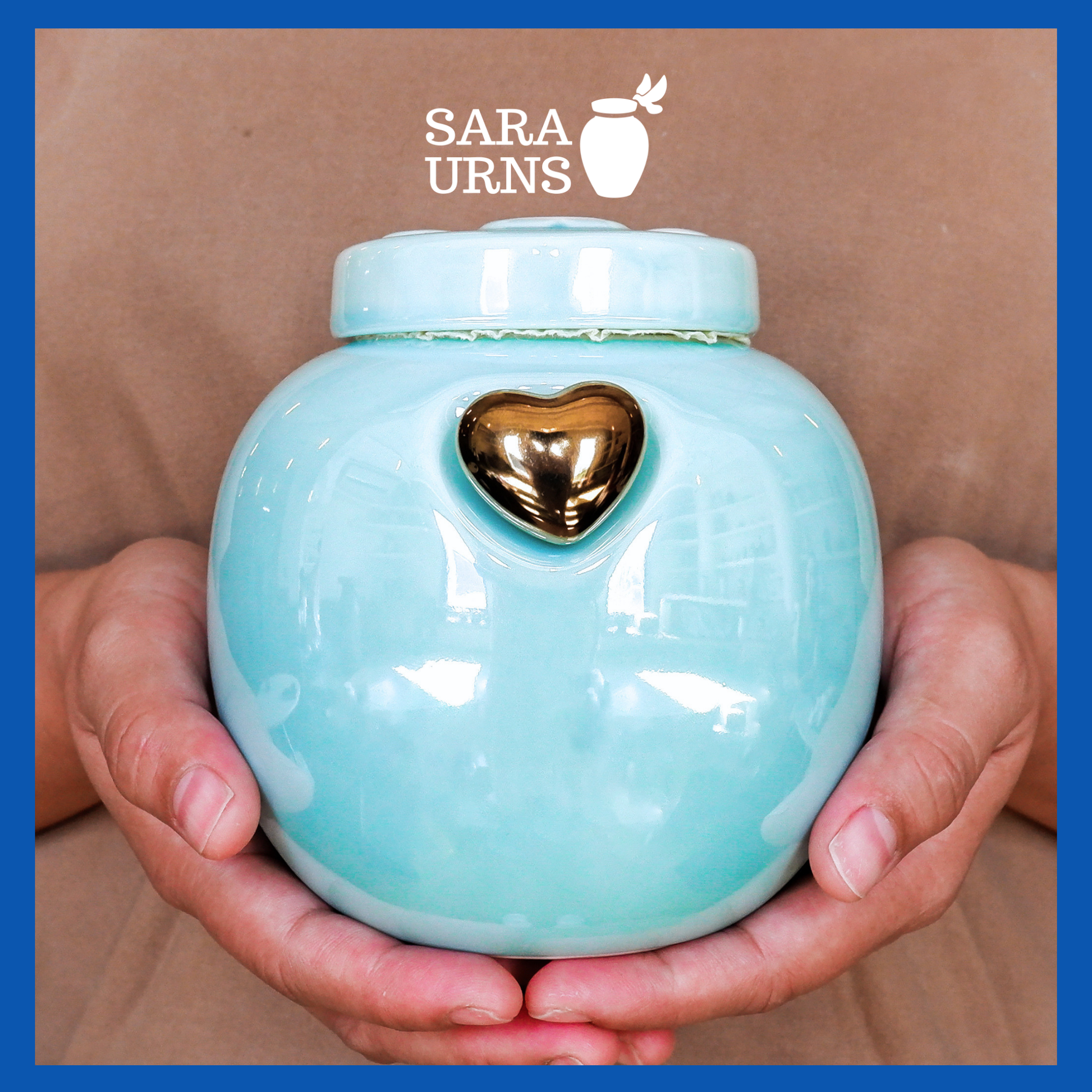 A presentation of a blue ceramic pet urn held by an adult woman with two palms.