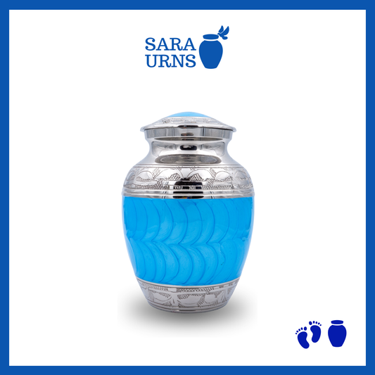 A bright blue polished brass metal baby urn with an enamel finish and hand-etched details over a white background.