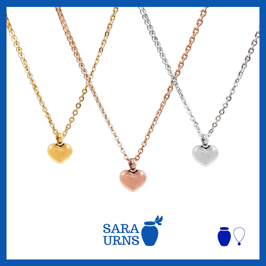 A presentation of gold, silver and rose gold ash necklaces that are heart-shaped over a white background.