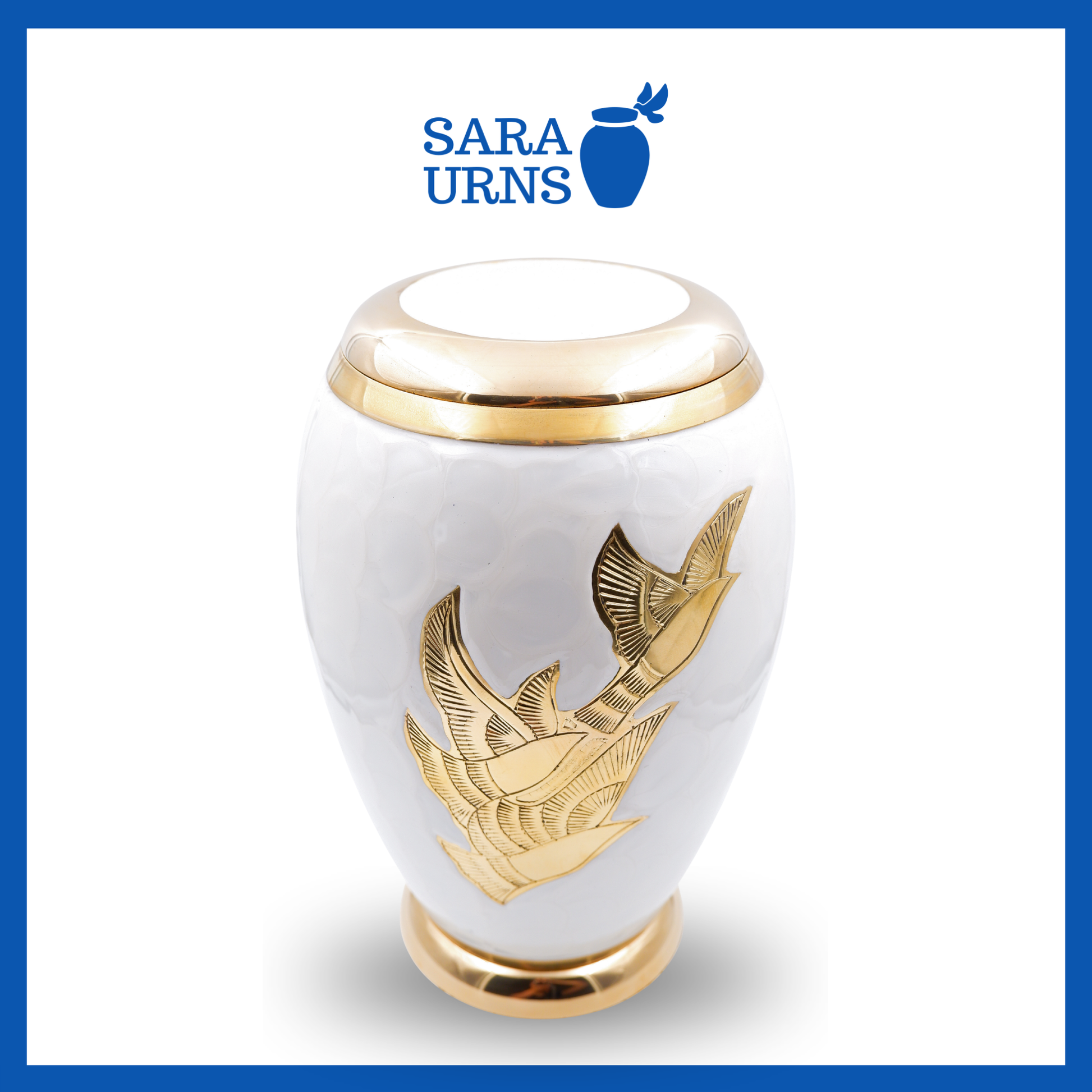 A higher angle of a white polished brass metal urn with golden, hand-etched winged doves over a white background.
