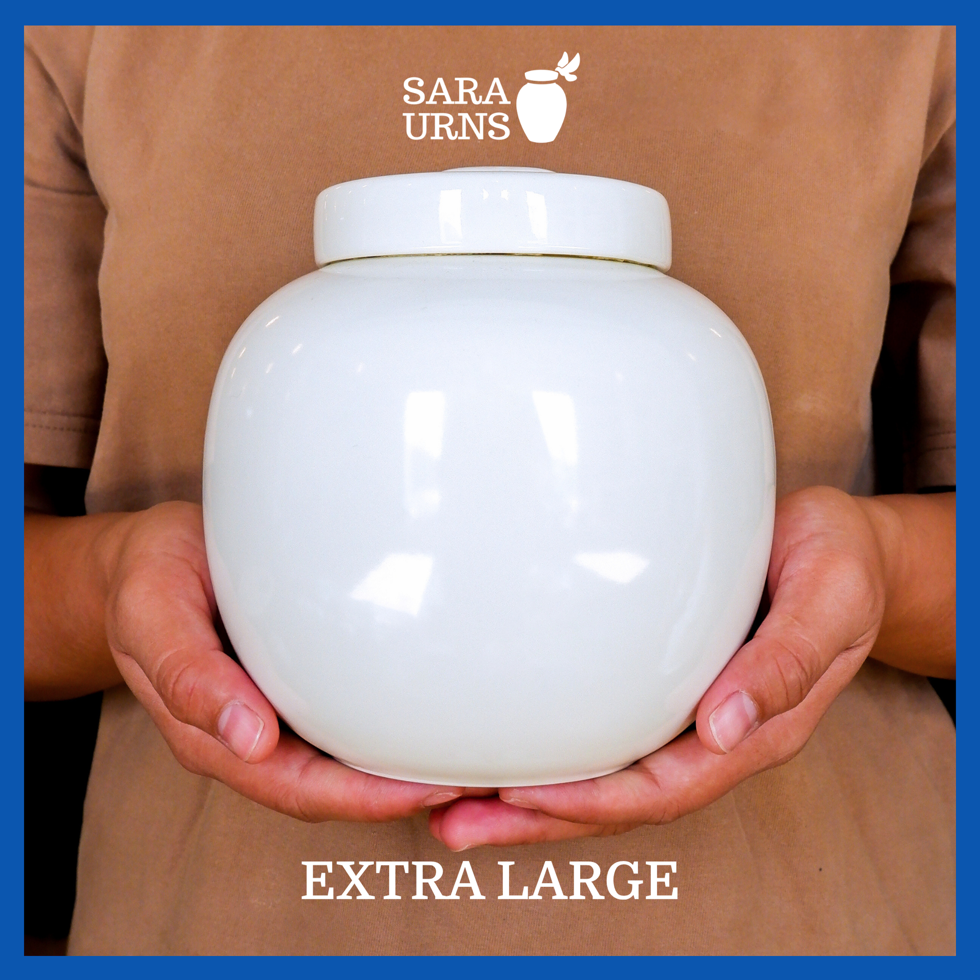 A presentation of an extra large, white polished ceramic pet urn held by an adult woman with two palms.