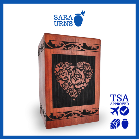A terracotta pine wooden urn with an intricate engraving of roses within a heart over a white background.