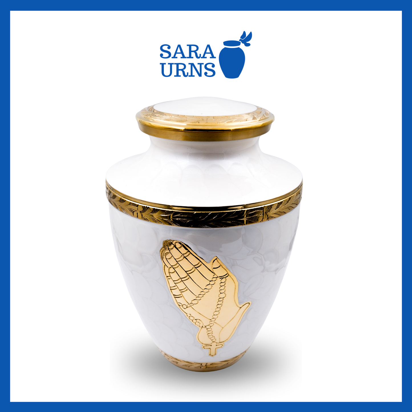 A higher angle of a white polished brass metal urn with hand-etched golden praying hands and details over a white background.