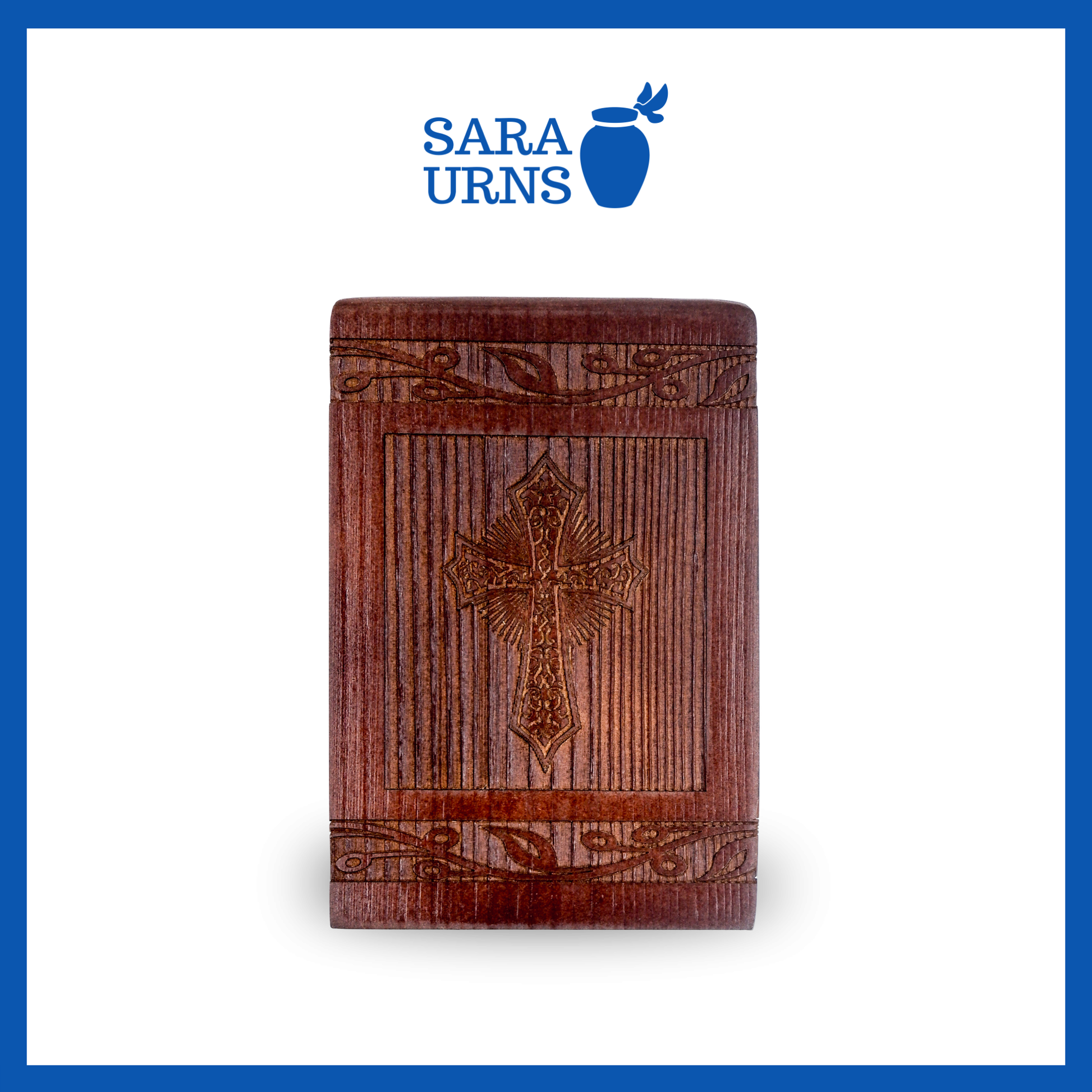 A front-facing shot of a brown pine wooden keepsake urn with an intricate engraving of the holy cross over a white background.