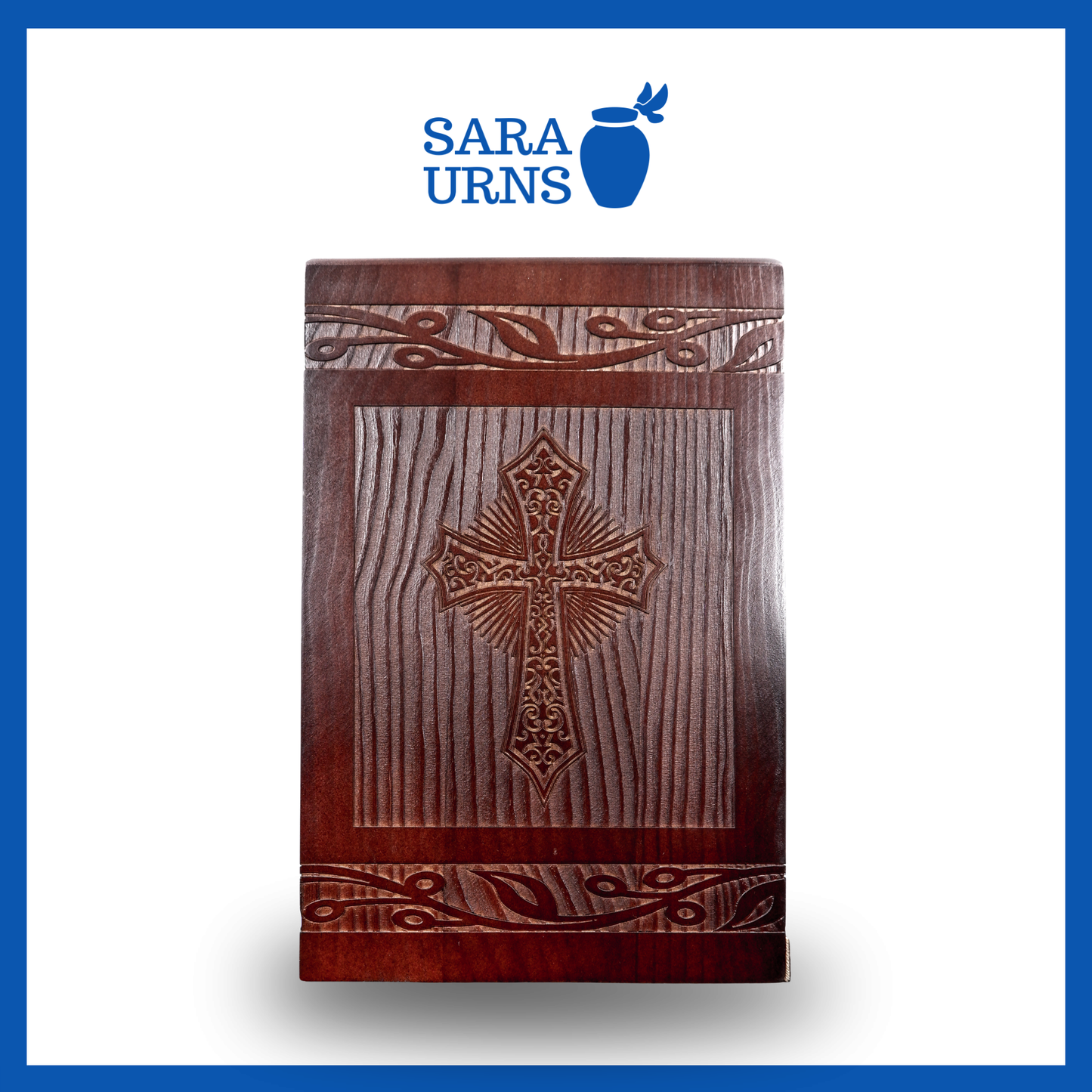 A front-facing shot of a brown pine wooden urn with an intricate engraving of the holy cross over a white background.