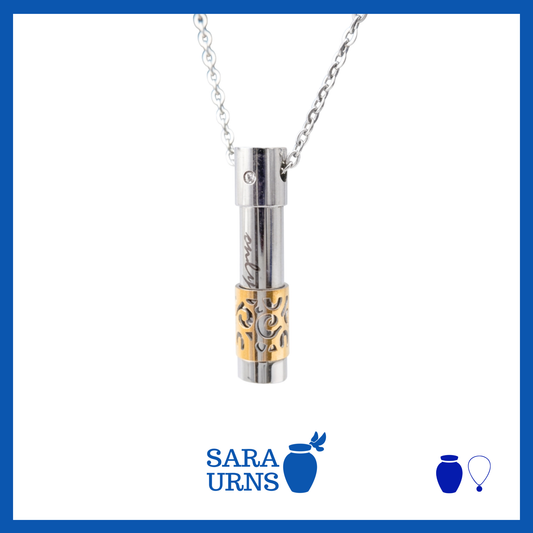 A presentation of a silver pendant with a gold abstract design ash necklace over a white background.