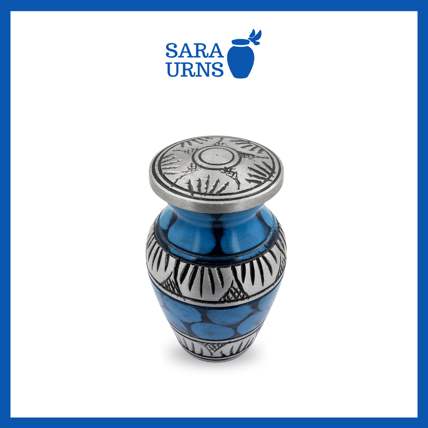 A higher angle of a blue aluminum metal keepsake urn with silver hand-etched designs and a painted pattern across the body and lid over a white background.