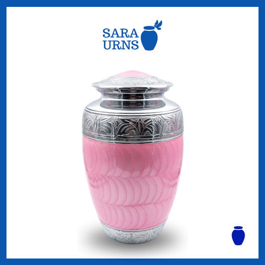 A pink polished aluminum metal urn with an enamel finish and hand-etched details over a white background.