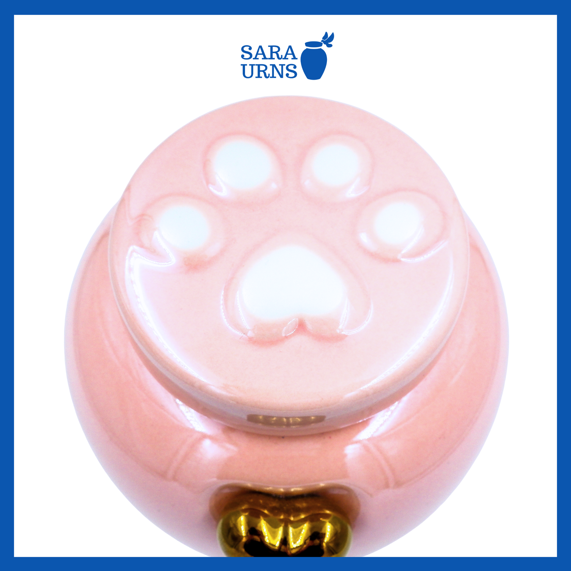 A higher angle of a pink ceramic pet urn with an embossed paw detail in the lid over a white background.