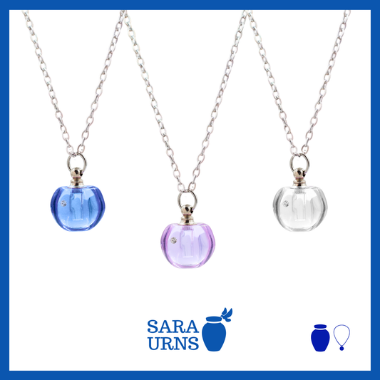 A presentation of ash necklaces’ pendants that is jewel-like in blue, purple and white over a white background.