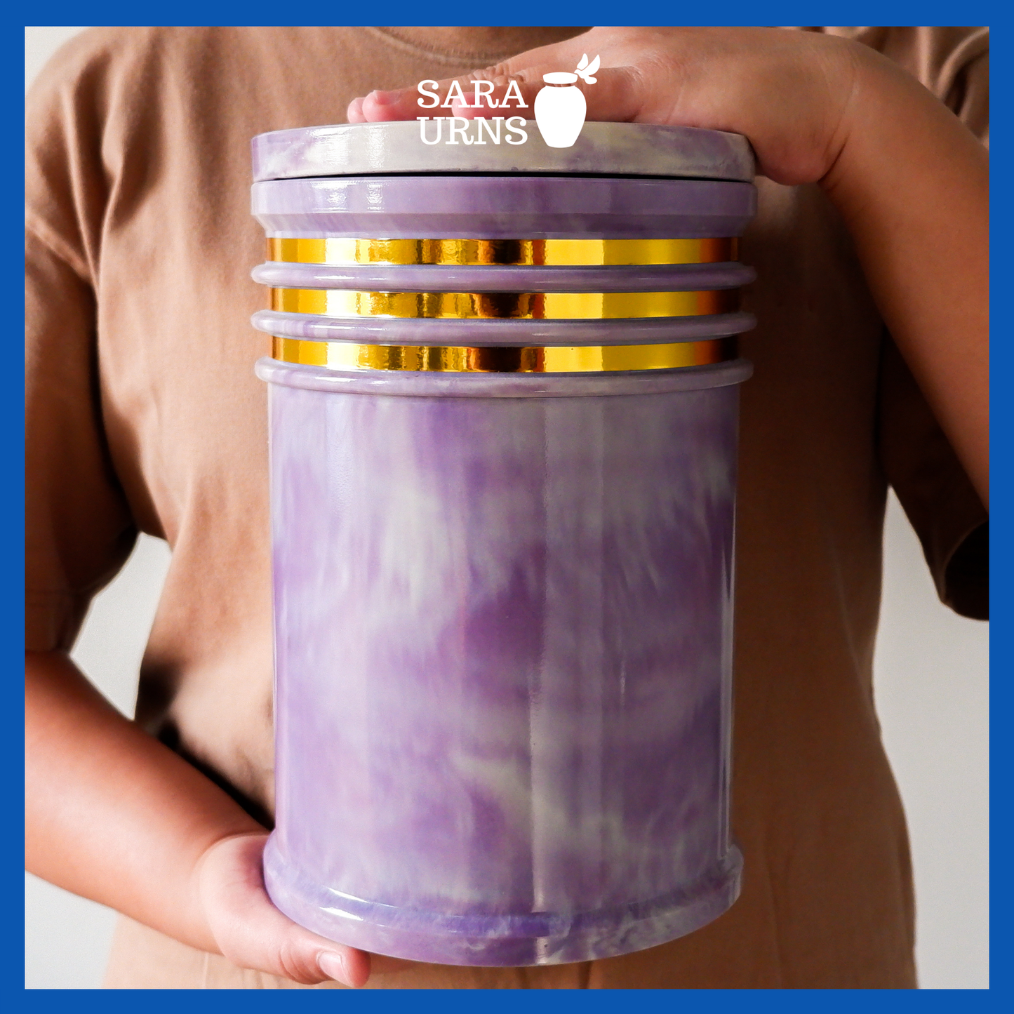 A presentation of a purple cultured marble urn held by an adult woman with two hands.