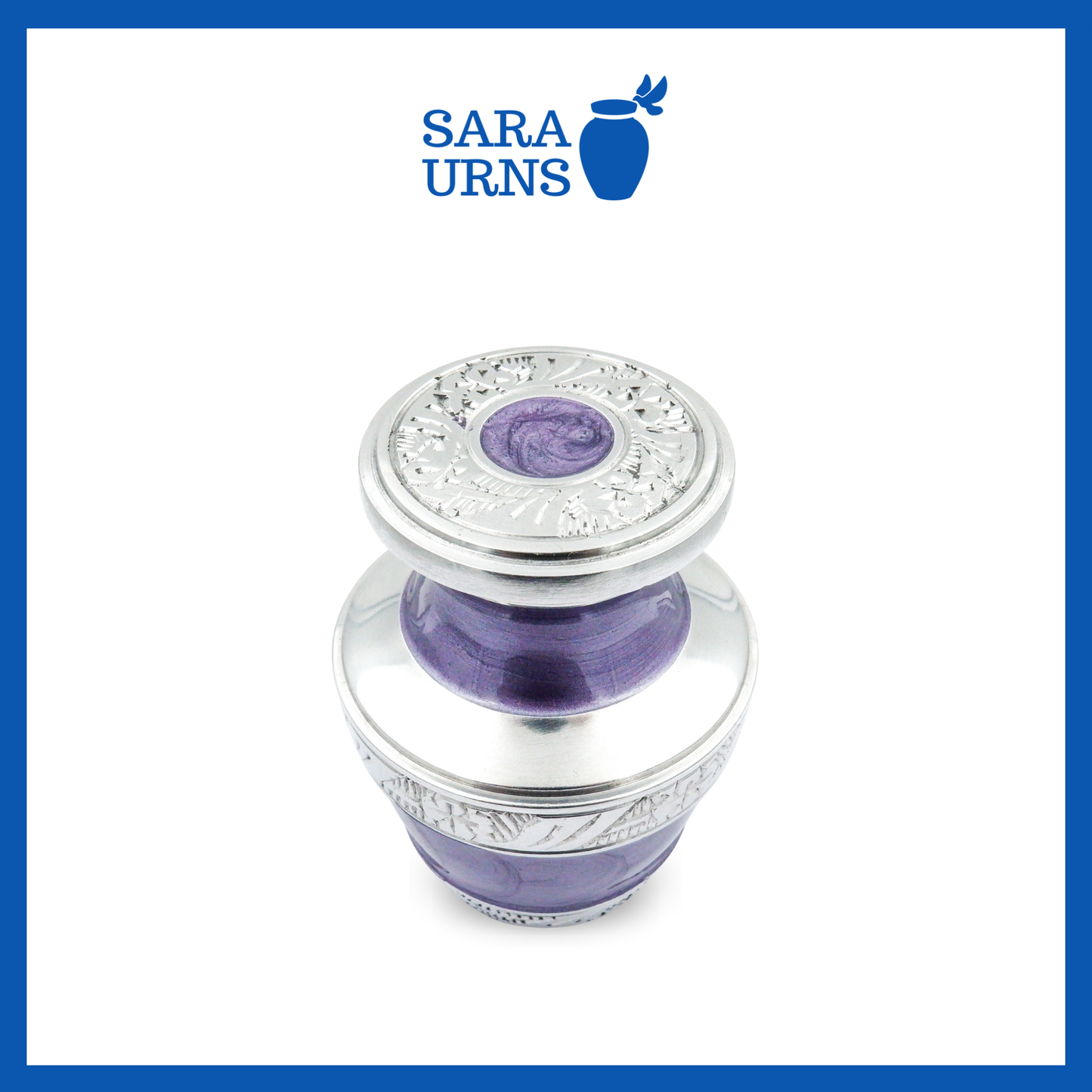 A higher angle of a purple aluminum metal keepsake urn with silver hand-etched designs across the body and lid over a white background.