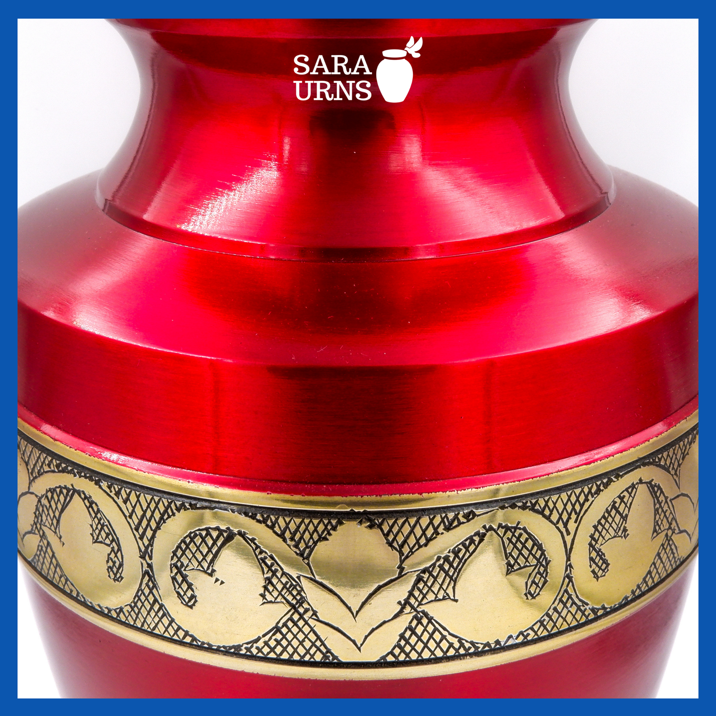 A red polished brass metal urn which highlights its golden hand-etched details across the lid and body.
