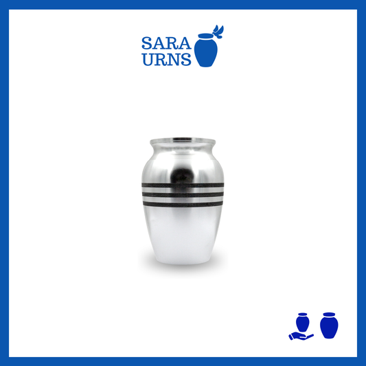 A silver alloy metal keepsake urn with three black stripes over a white background.