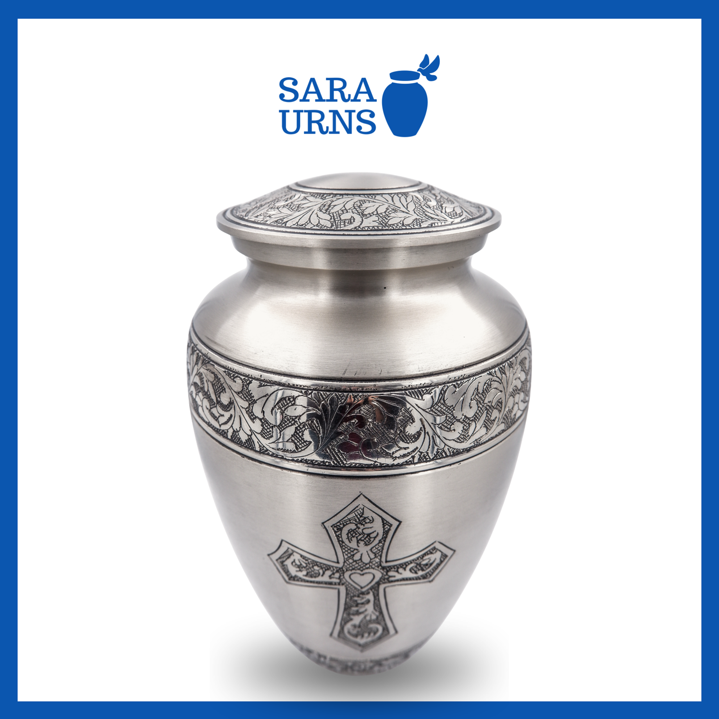 A higher angle of a silver polished brass metal urn with a hand-etched holy cross over a white background.