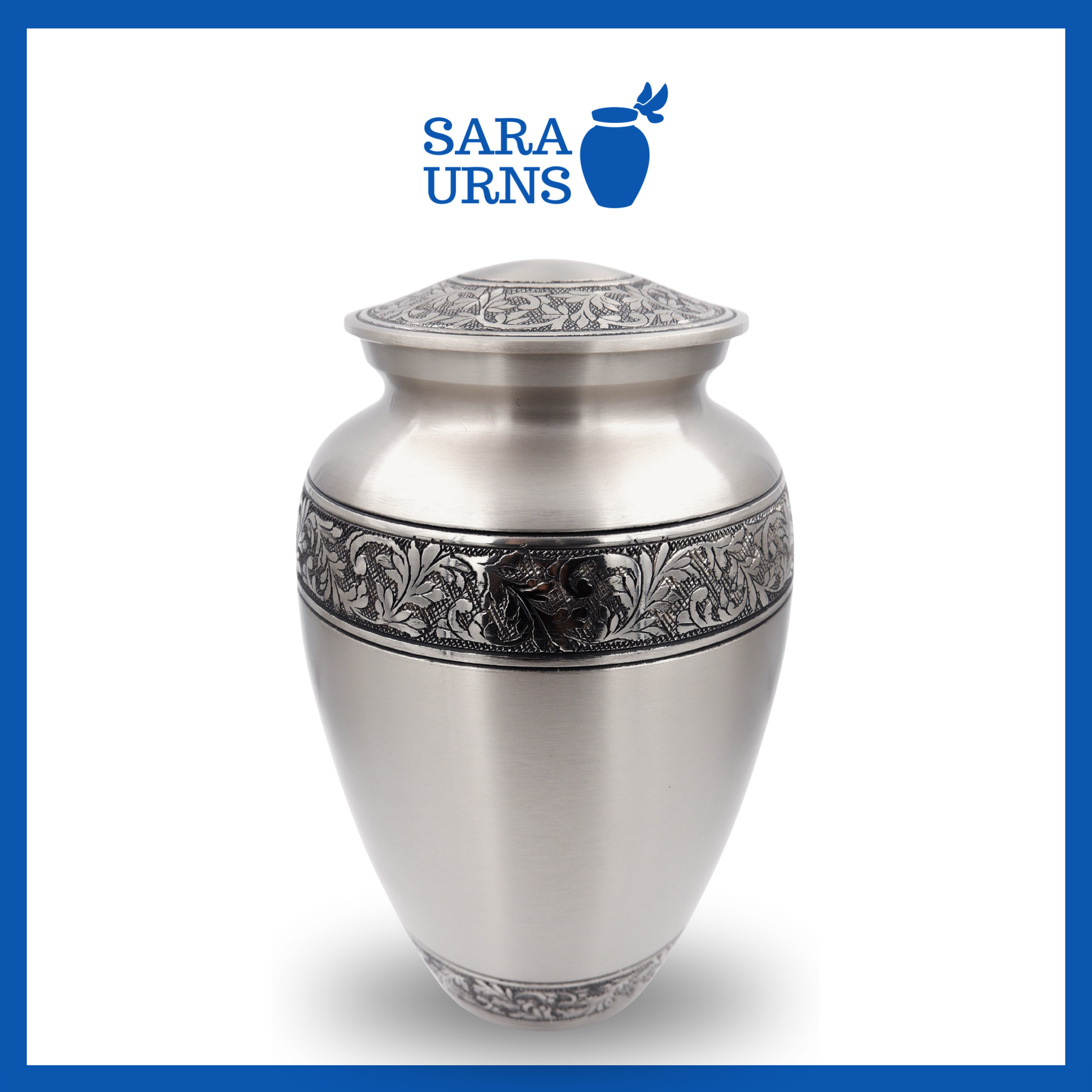 A higher angle of a silver polished brass metal urn with hand-etched details on its body and lid over a white background.
