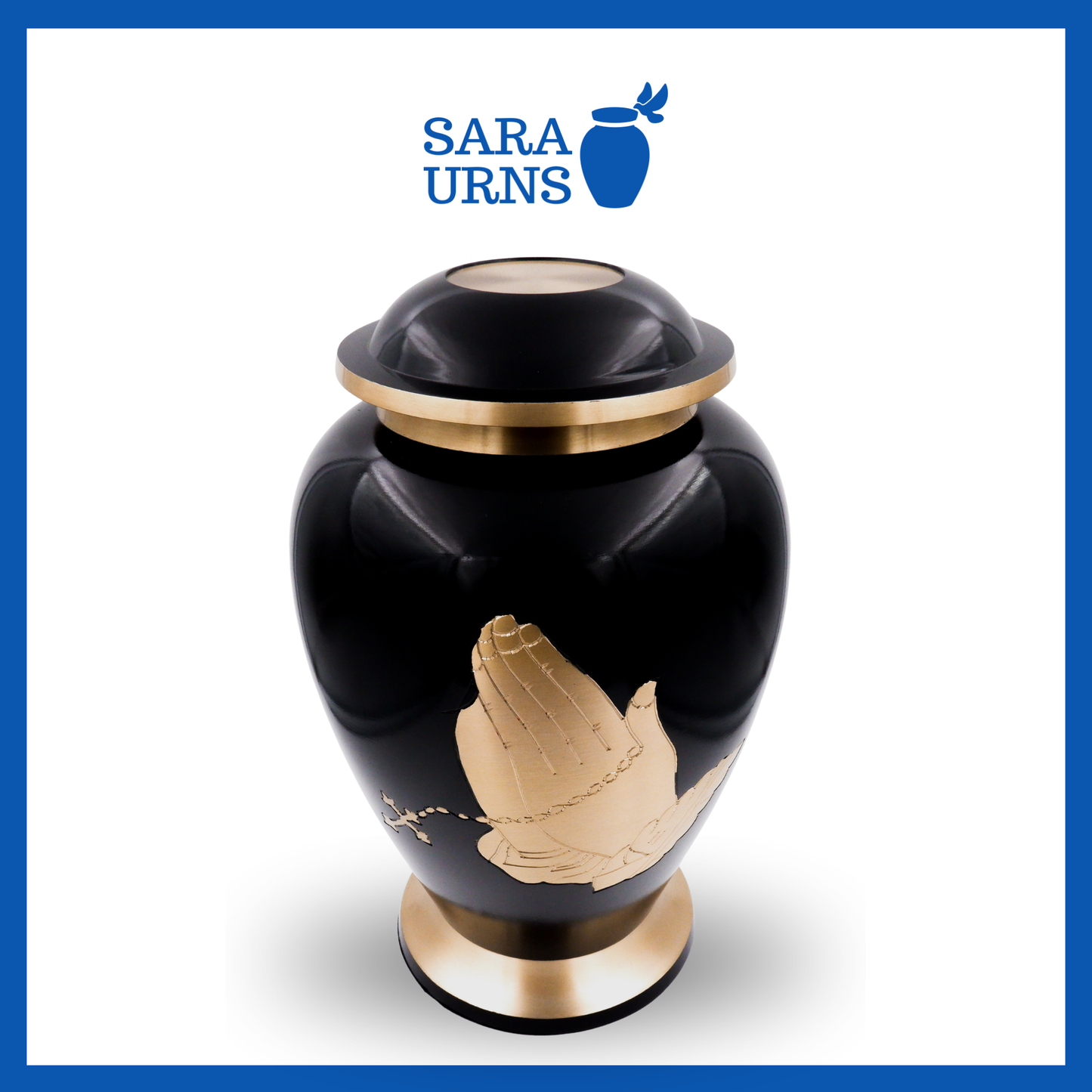 A higher angle of a black polished brass metal urn with a golden, hand-etched detail of praying with a rosary over a white background.
