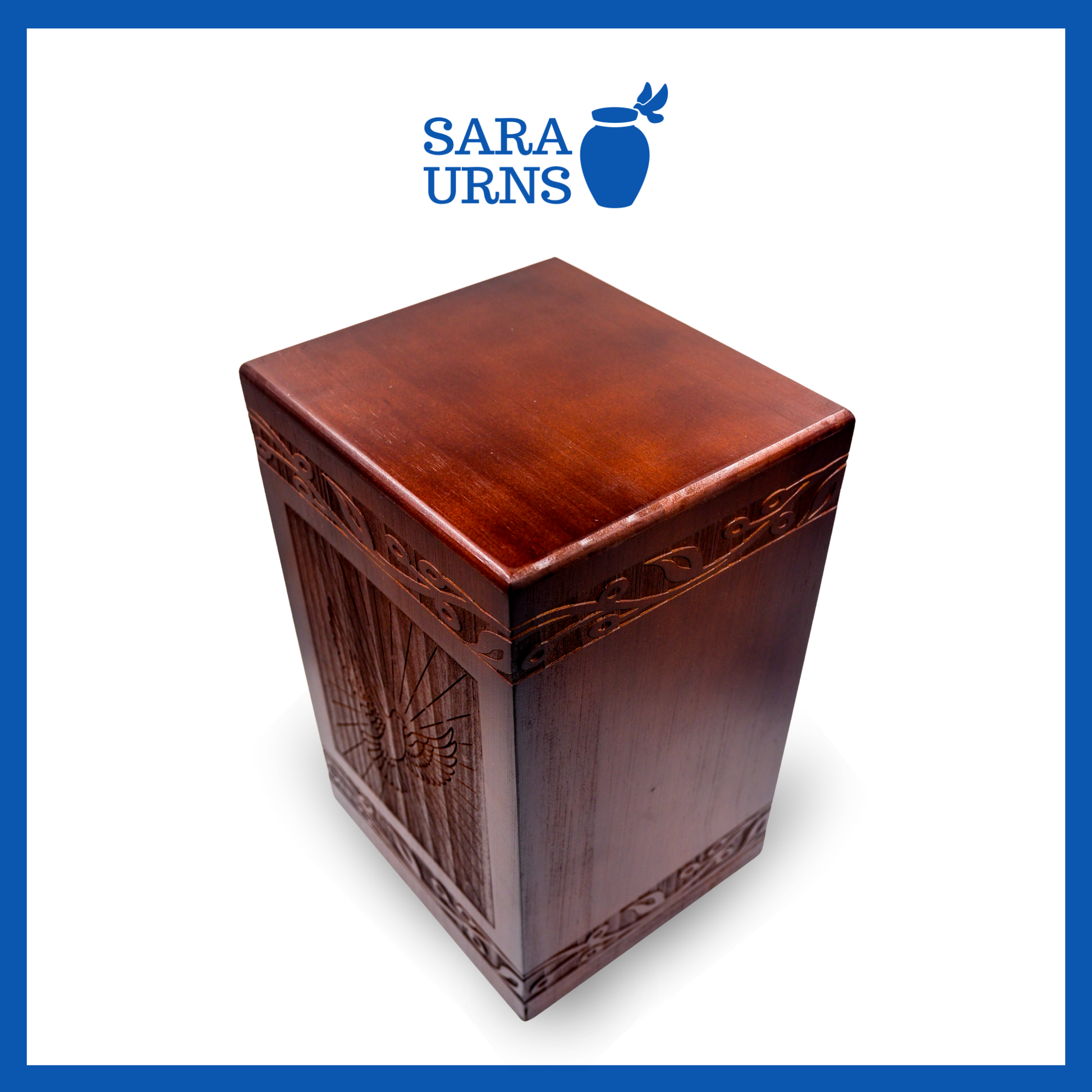 A higher angle of a brown pine wooden urn with an intricate engraving of a dove over a white background.
