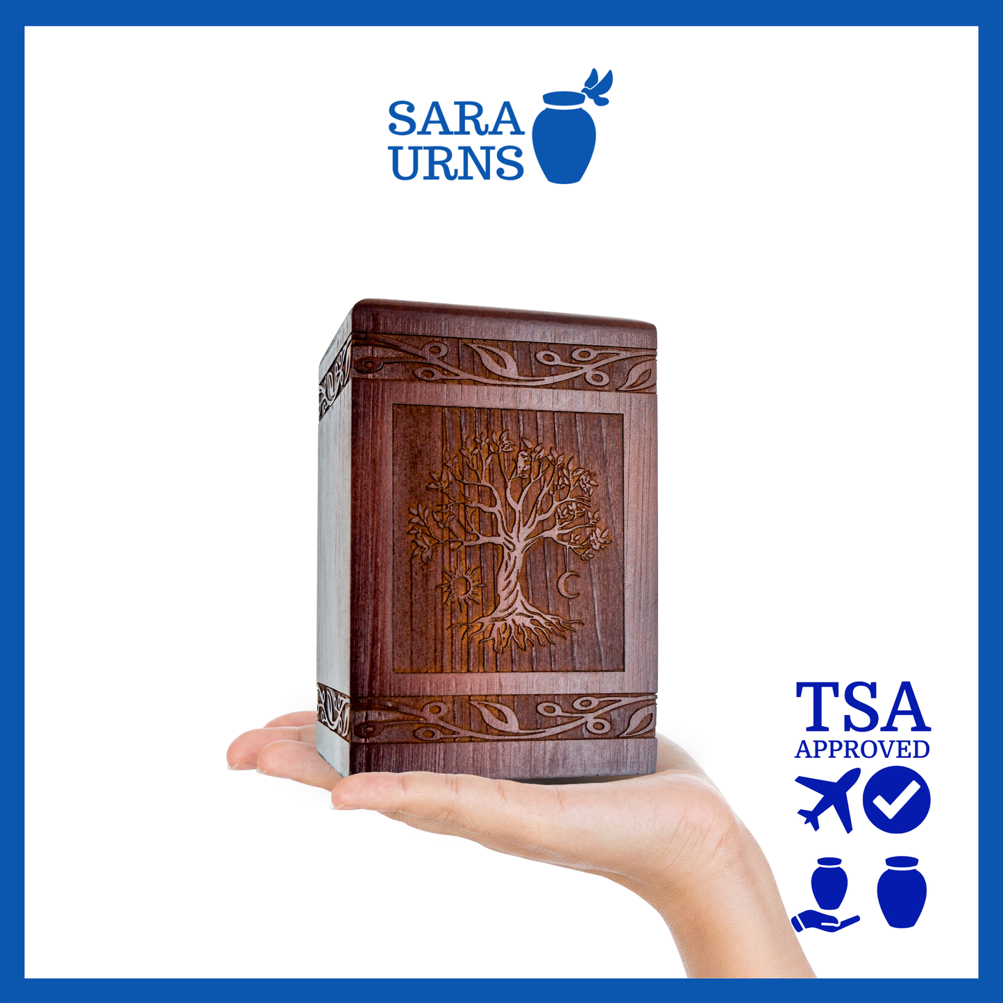 A brown pine wooden keepsake urn with an intricate engraving of the tree of life over a white background.