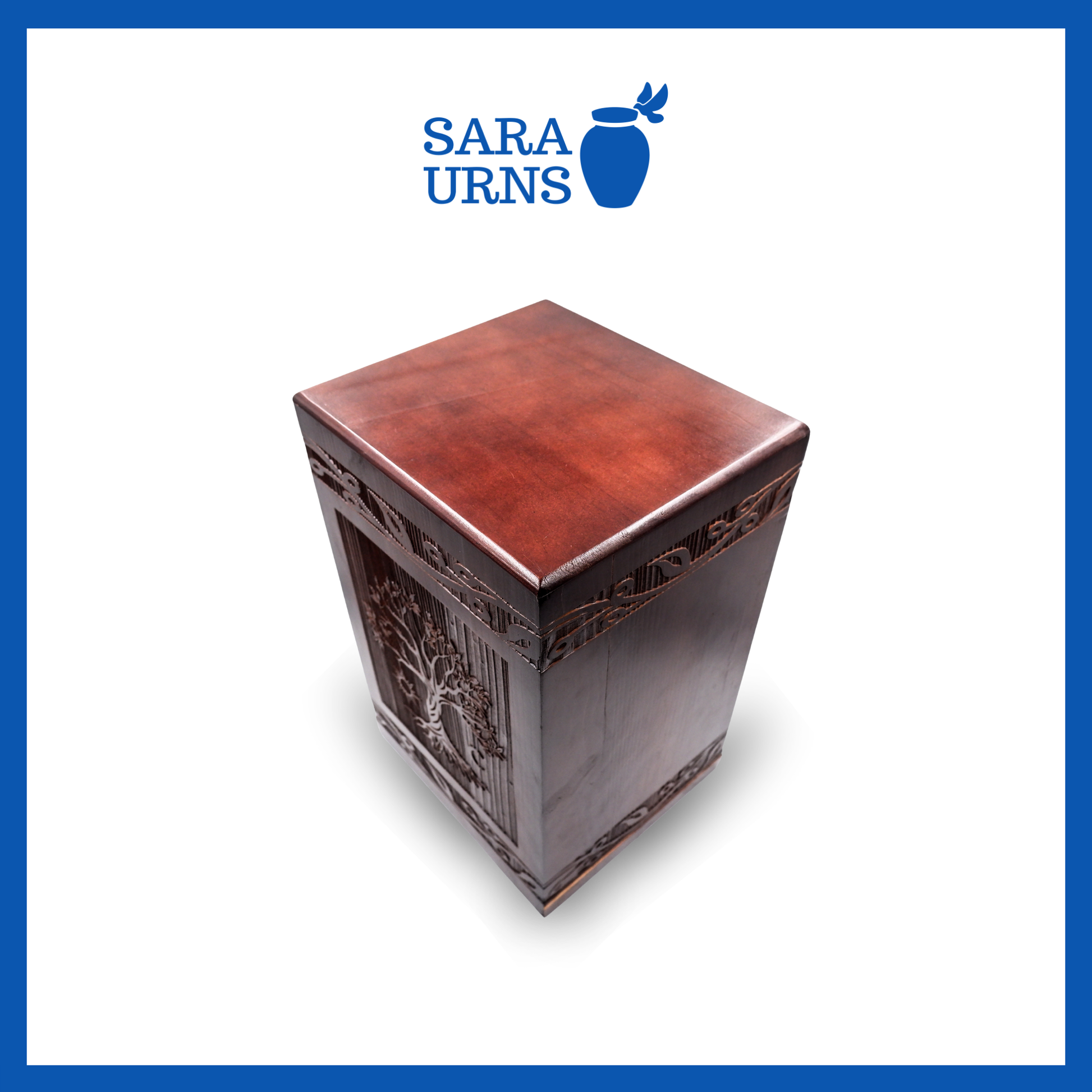 A second, higher angle of a brown pine wooden keepsake urn with an intricate engraving of the tree of life over a white background.