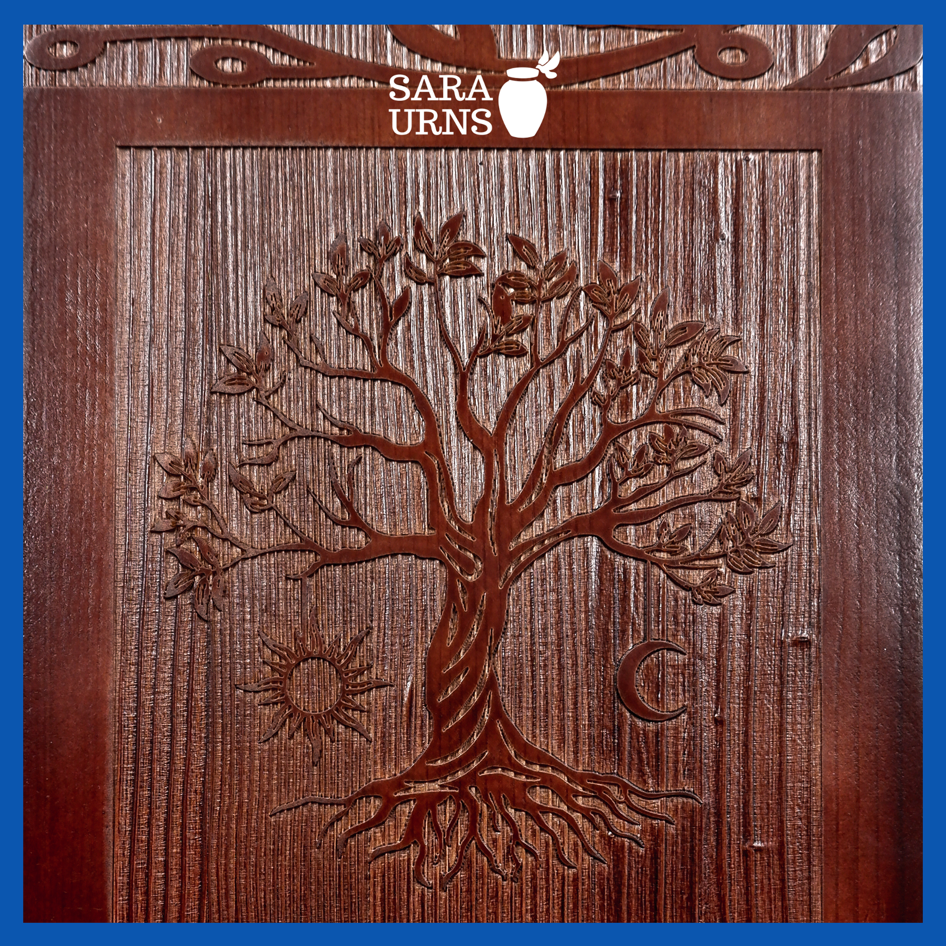 A close-up angle of a brown pine wooden urn with an intricate engraving of the tree of life over a white background.