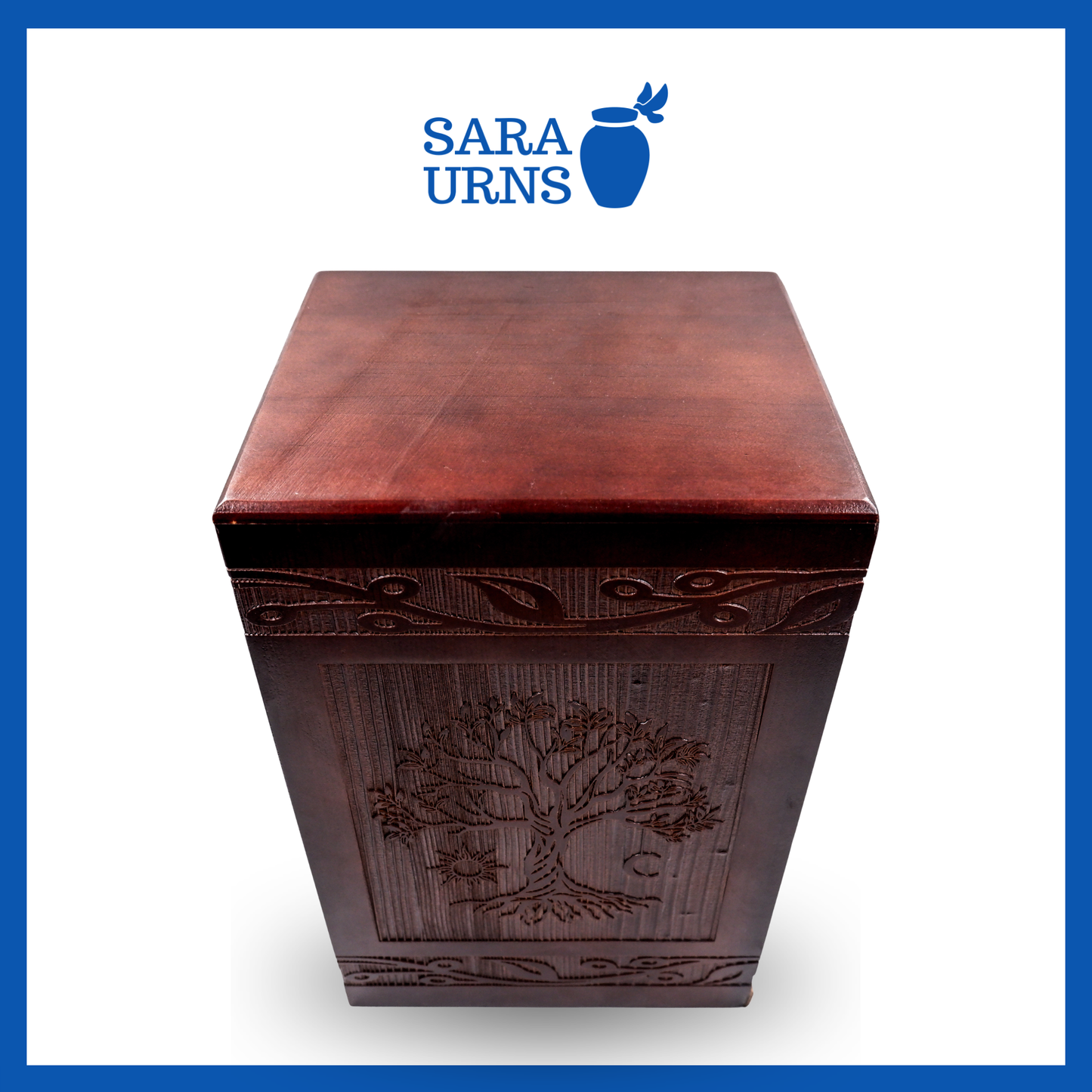 A higher angle of a brown pine wooden urn with an intricate engraving of the tree of life over a white background.
