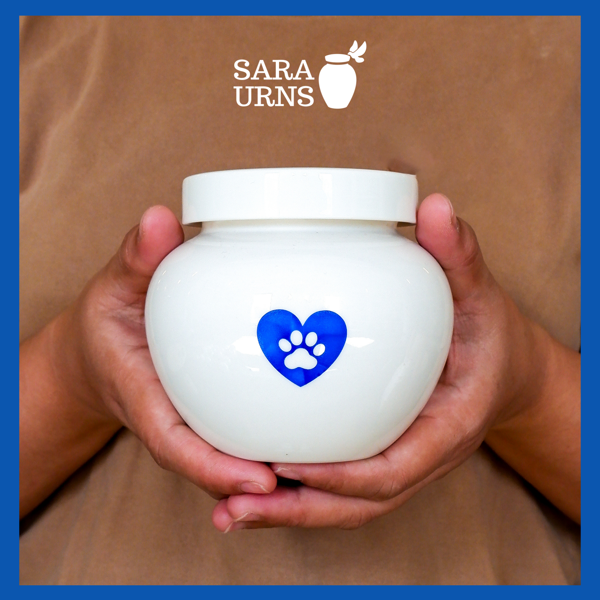 A presentation of a white polished ceramic pet urn held by an adult woman with two palms.