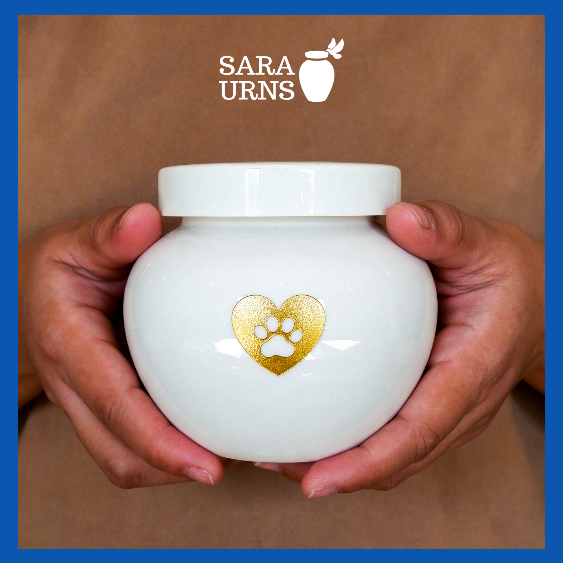A presentation of a white polished ceramic pet urn held by an adult woman with two palms.