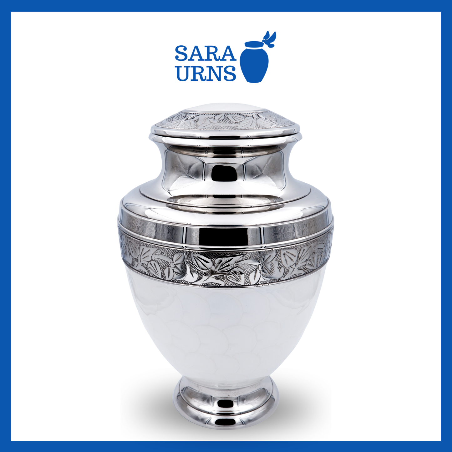 A higher angle of a white polished brass metal urn with an enamel finish and silver hand-etched details over a white background.