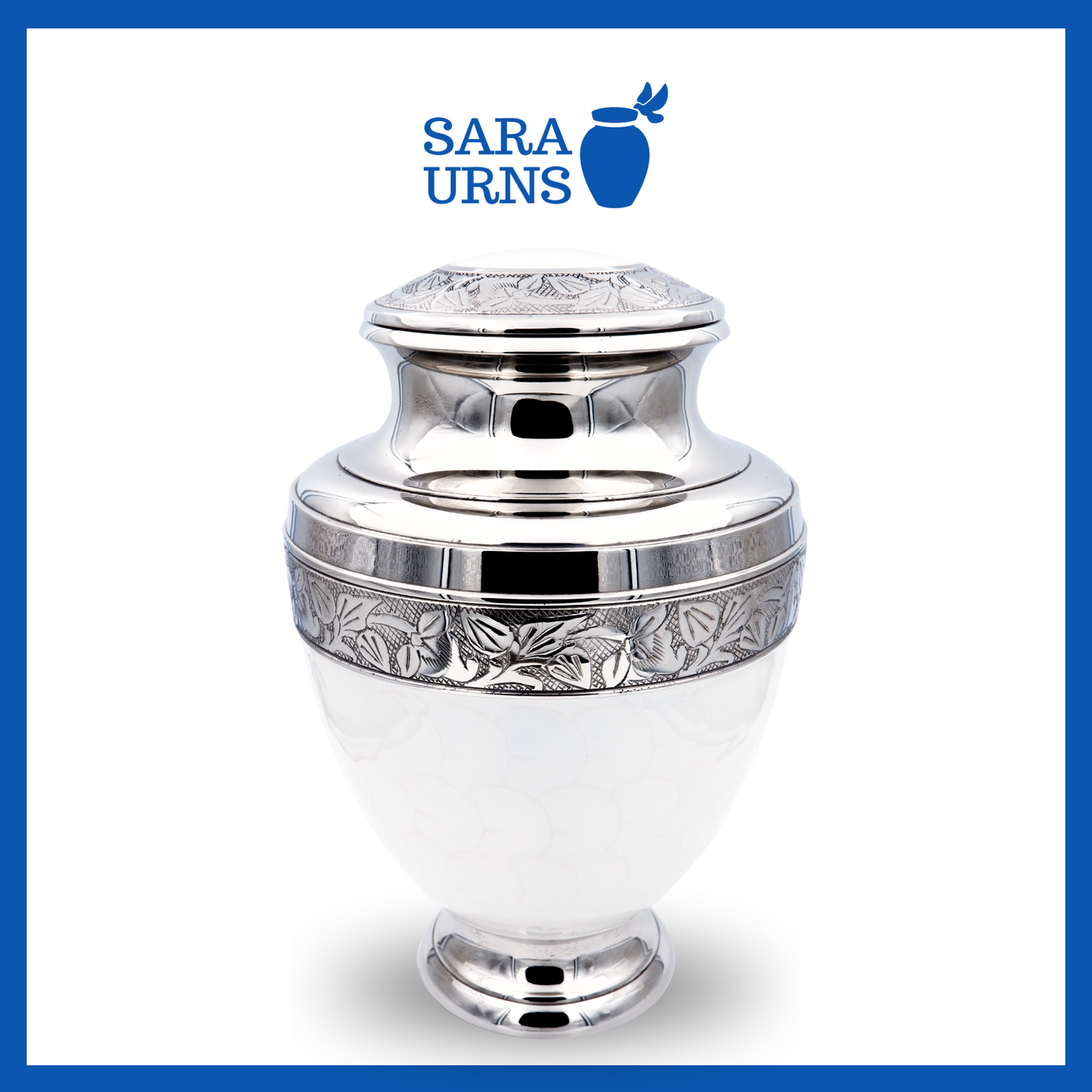 A higher angle of a white polished brass metal urn with an enamel finish and silver hand-etched details over a white background.