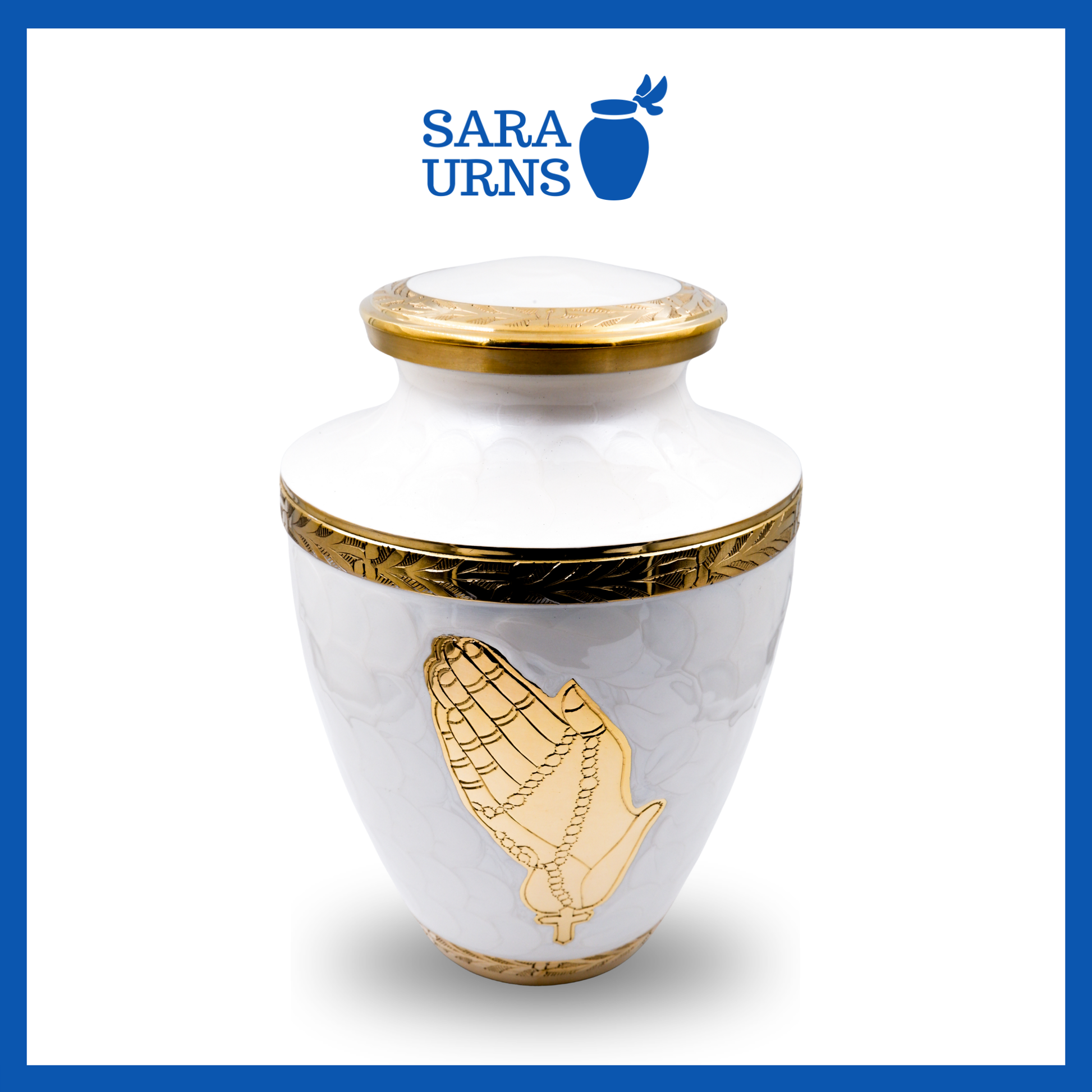 A higher angle of a white polished brass metal urn with golden details including a hand-etched praying hands over a white background.
