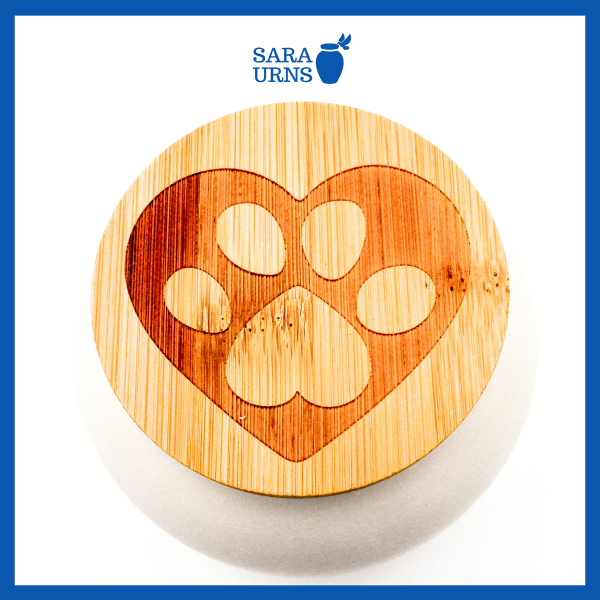 A higher angle of a white ceramic pet urn with a matte finish, an embossed paw at the center and a bamboo lid.