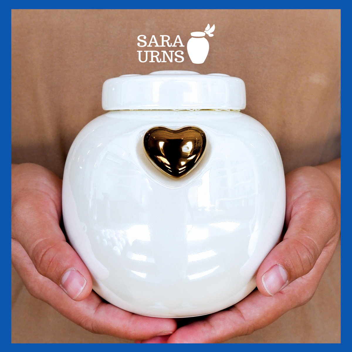 A presentation of a white ceramic pet urn held by an adult woman with two palms.